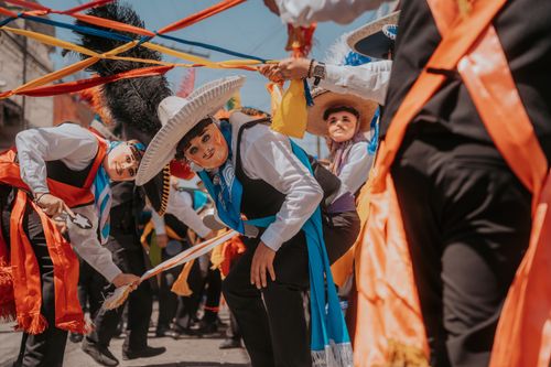 Free Colorful traditional Mexican dancers in vibrant attire at a festival in Puebla, Mexico. Stock Photo