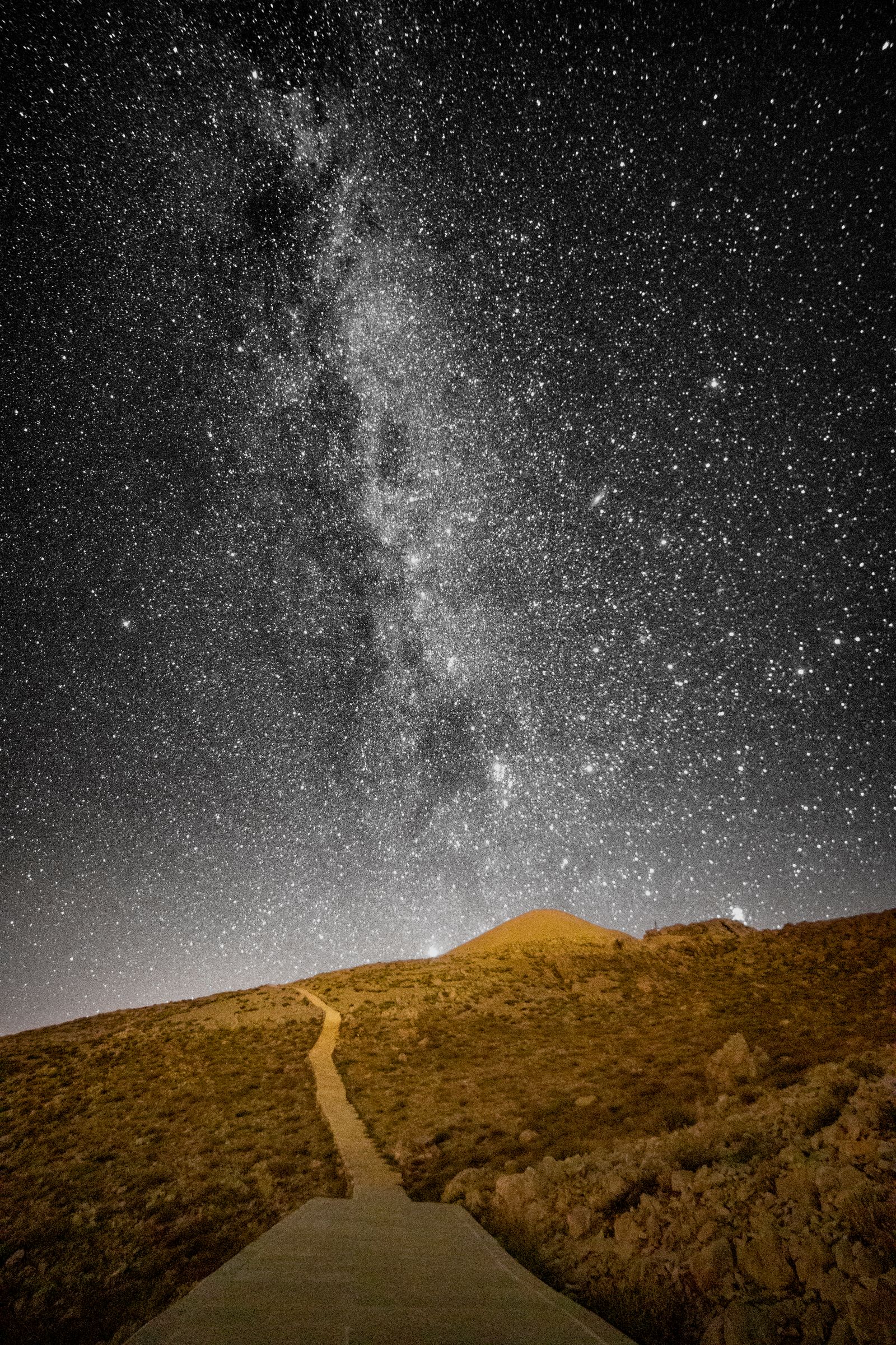 The milky way over a desert road · Free Stock Photo