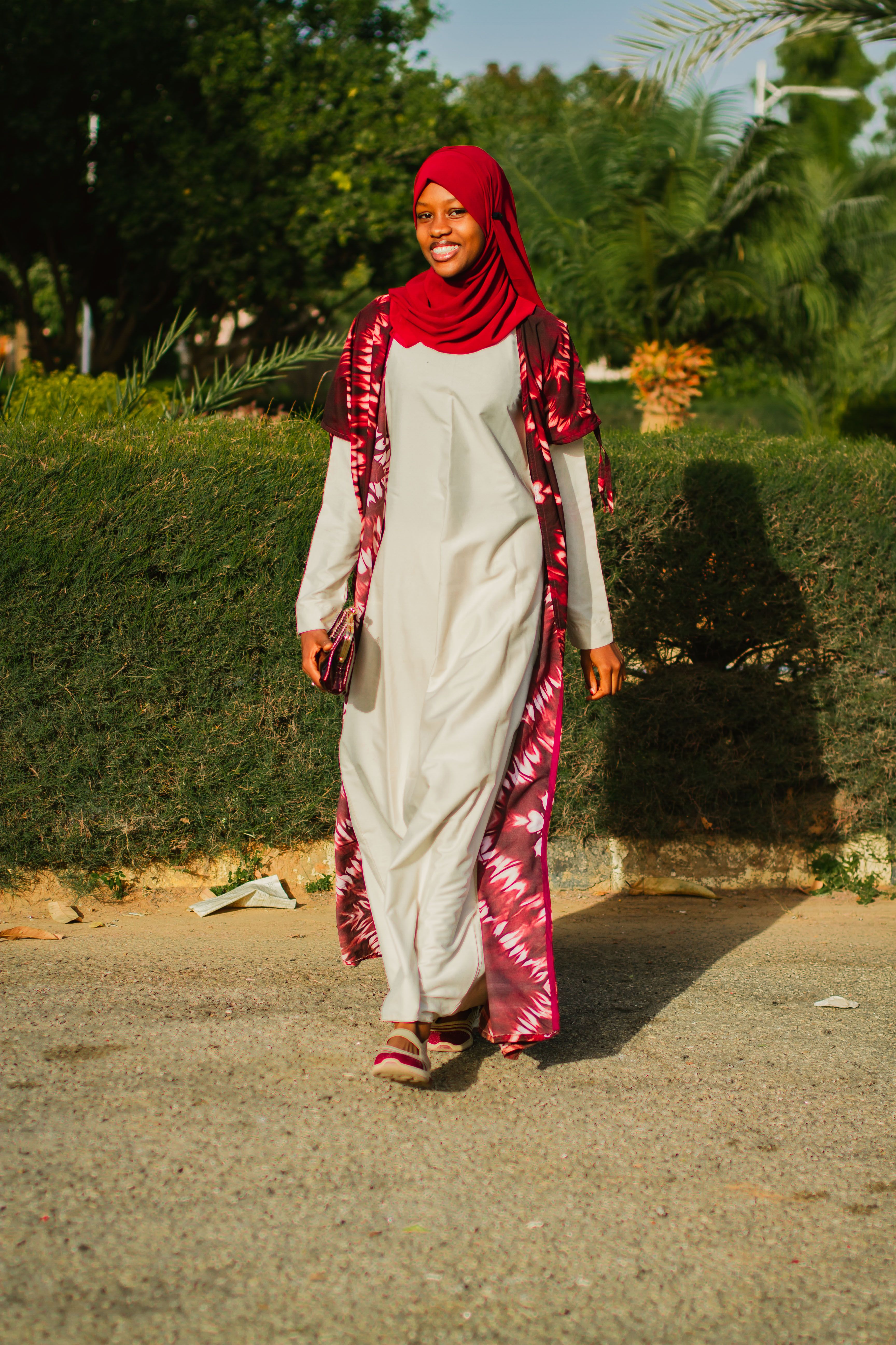 Portrait of a Woman in Red Hijab Outdoors · Free Stock Photo