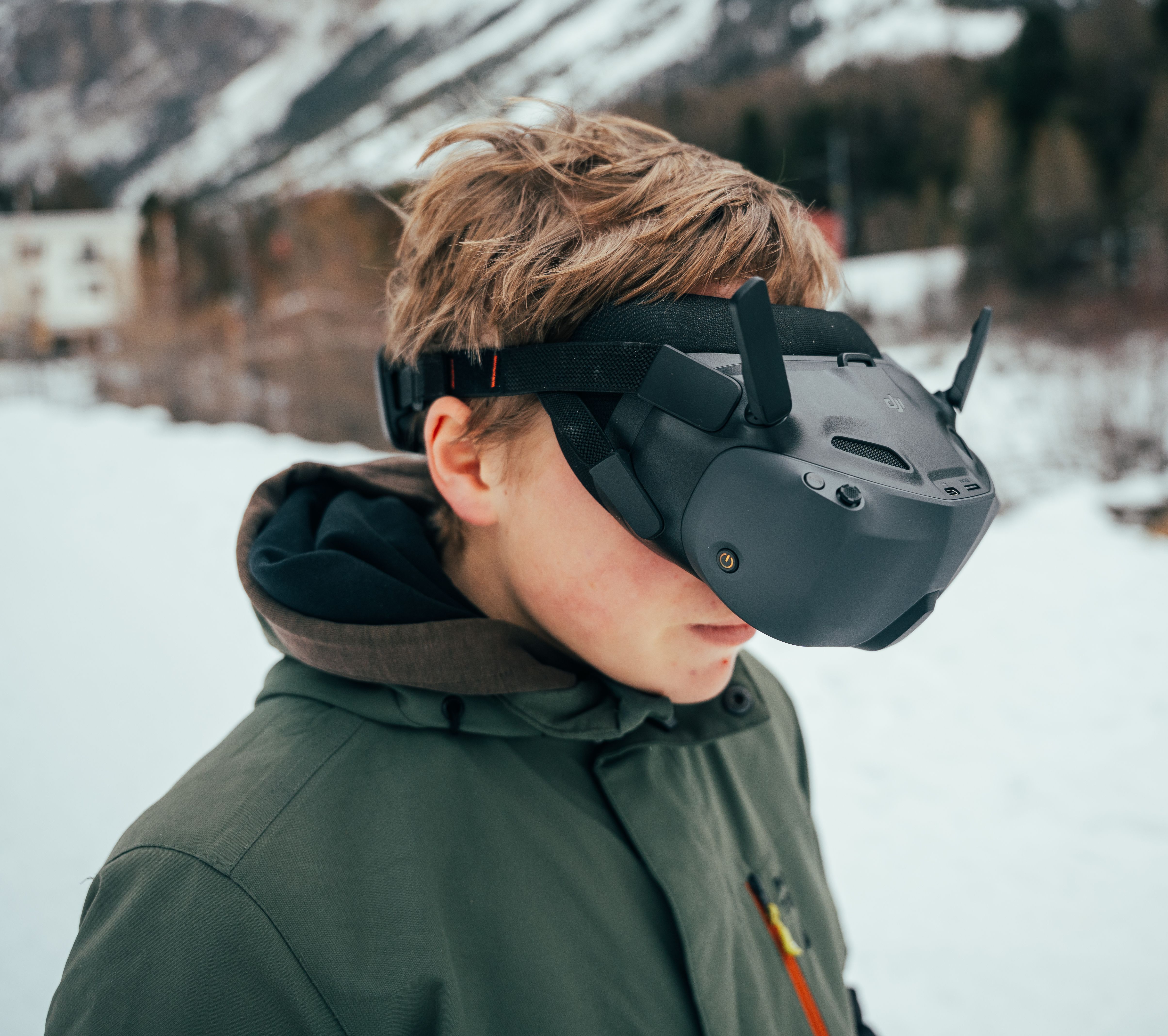 Teen Experiencing VR in Scenic Winter Landscape · Free Stock Photo