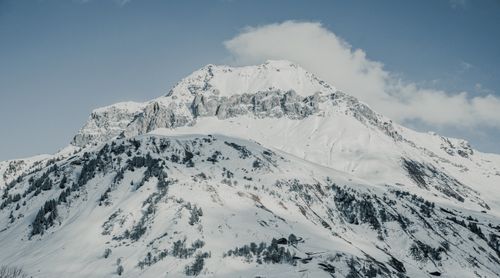 Free Stunning snow-covered mountain peaks under a clear blue winter sky. Stock Photo