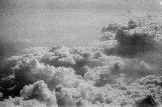 Dramatic monochrome aerial view of clouds creating a textured sky scene.