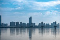 Modern City Skyline with Bridge Over Water