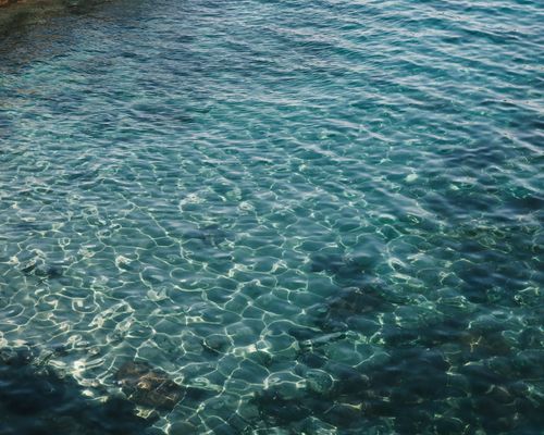 Free Pristine turquoise water rippling in Amasra, Bartın, perfect for travel inspiration. Stock Photo