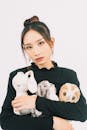 Woman Posing with Stuffed Animals in Studio