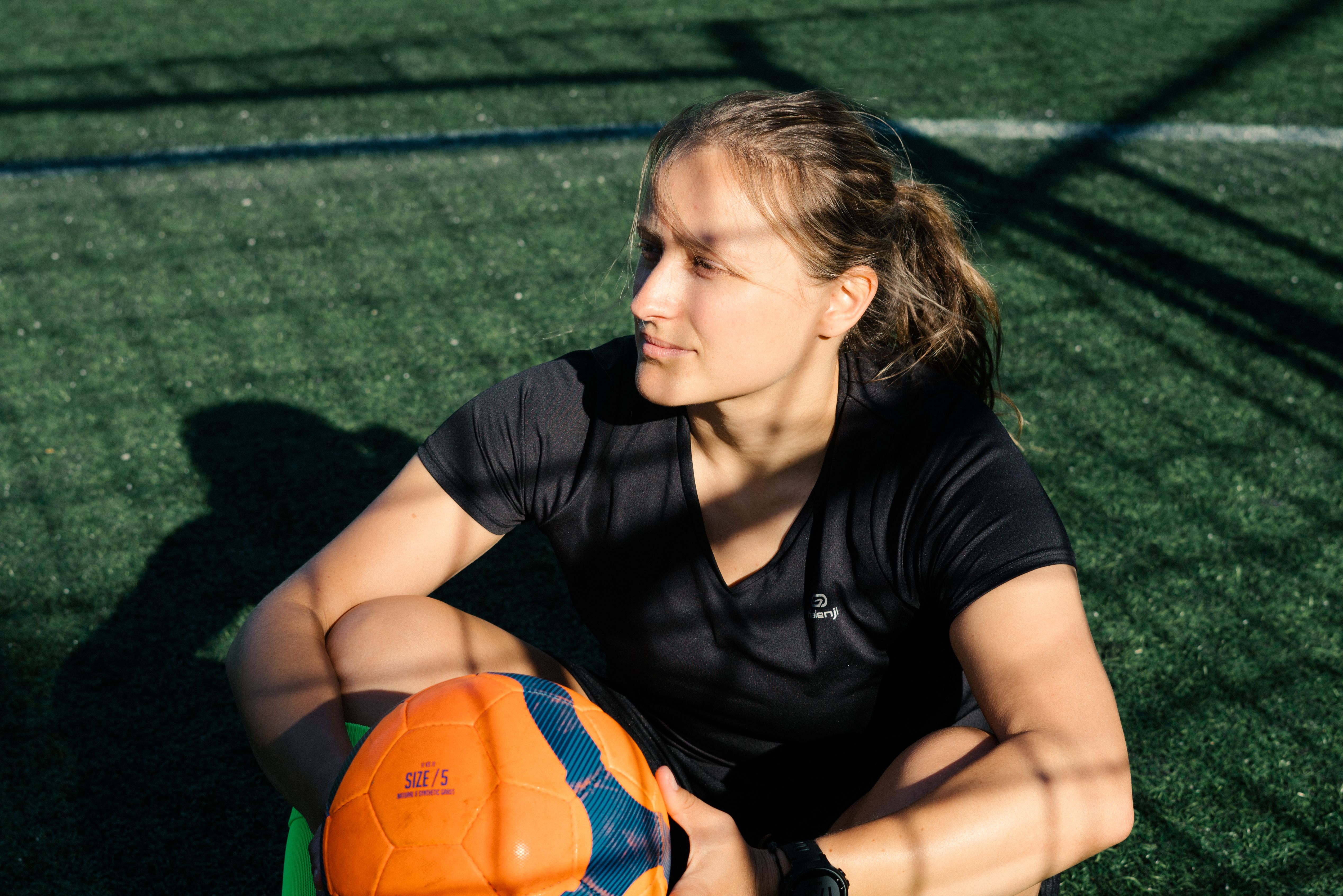 Soccer player in spotlight representing exposure