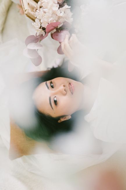 Serene portrait of a woman with delicate flowers, soft and dreamy style.