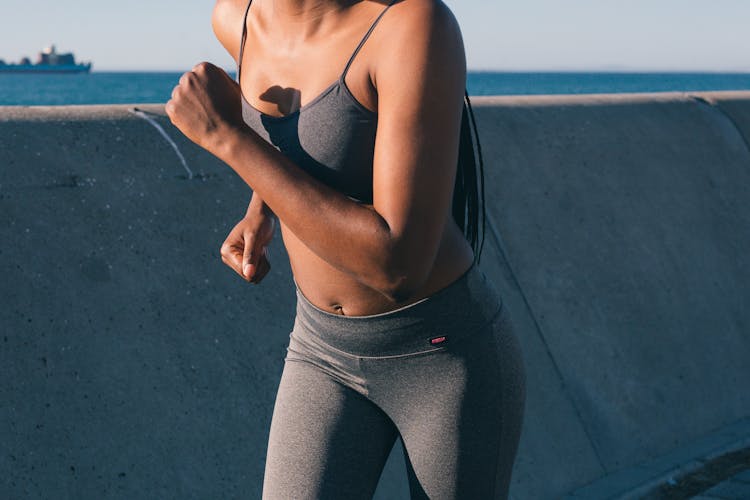 Woman In Gray Activewear Jogging