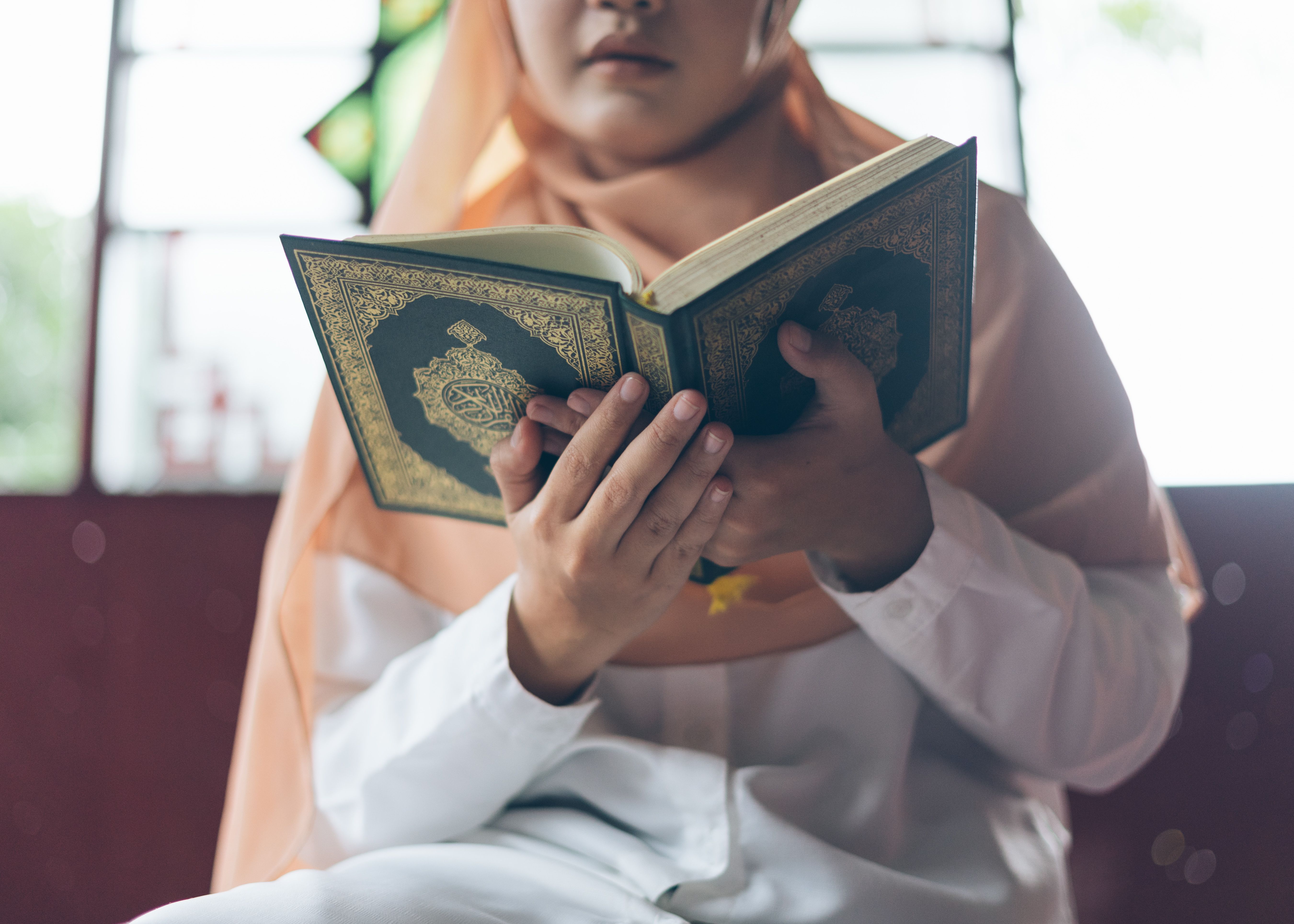 Muslim woman reading Quran