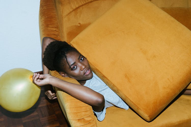 Photo Of Woman Laying On Couch 