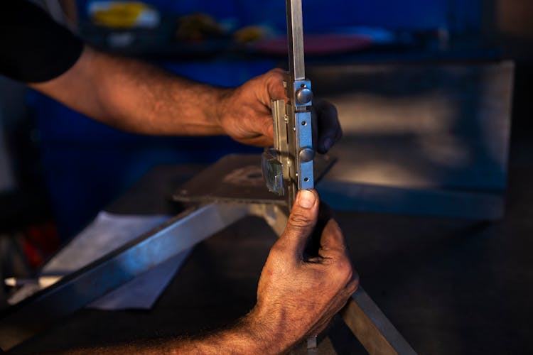 Person Working On Metal