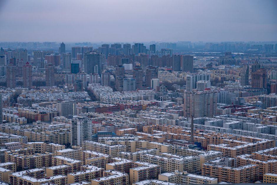 Unforgettable Yangshuo Helicopter Tour from Yangshuo Hotel Review: Soaring Over China's Most Spectacular Karst Landscape Review 2026 - Expansive view of Harbin city skyline under a winter sky, showcasing dense urban architecture.
