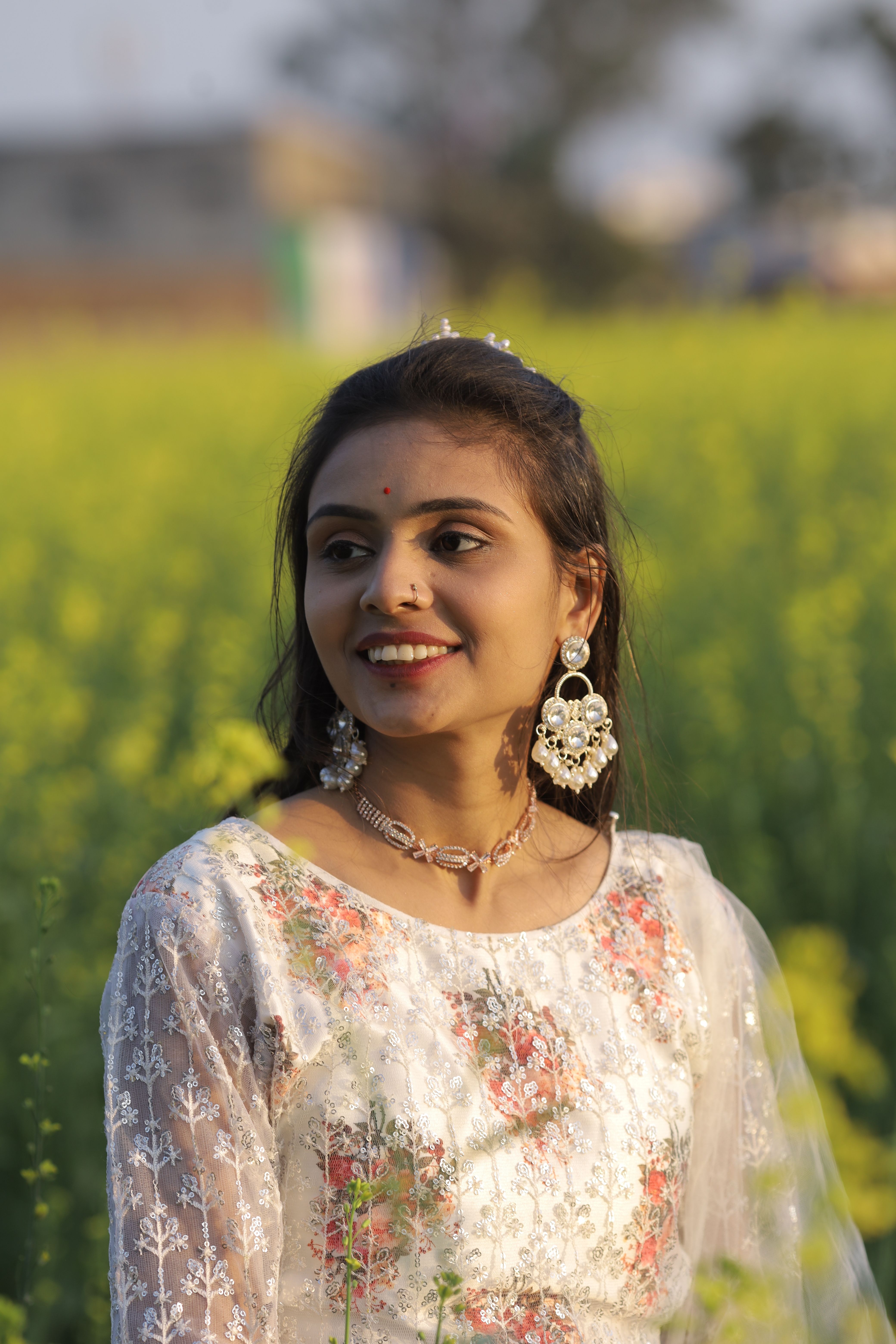 Smiling Woman in Traditional Dress in Flower Field · Free Stock Photo
