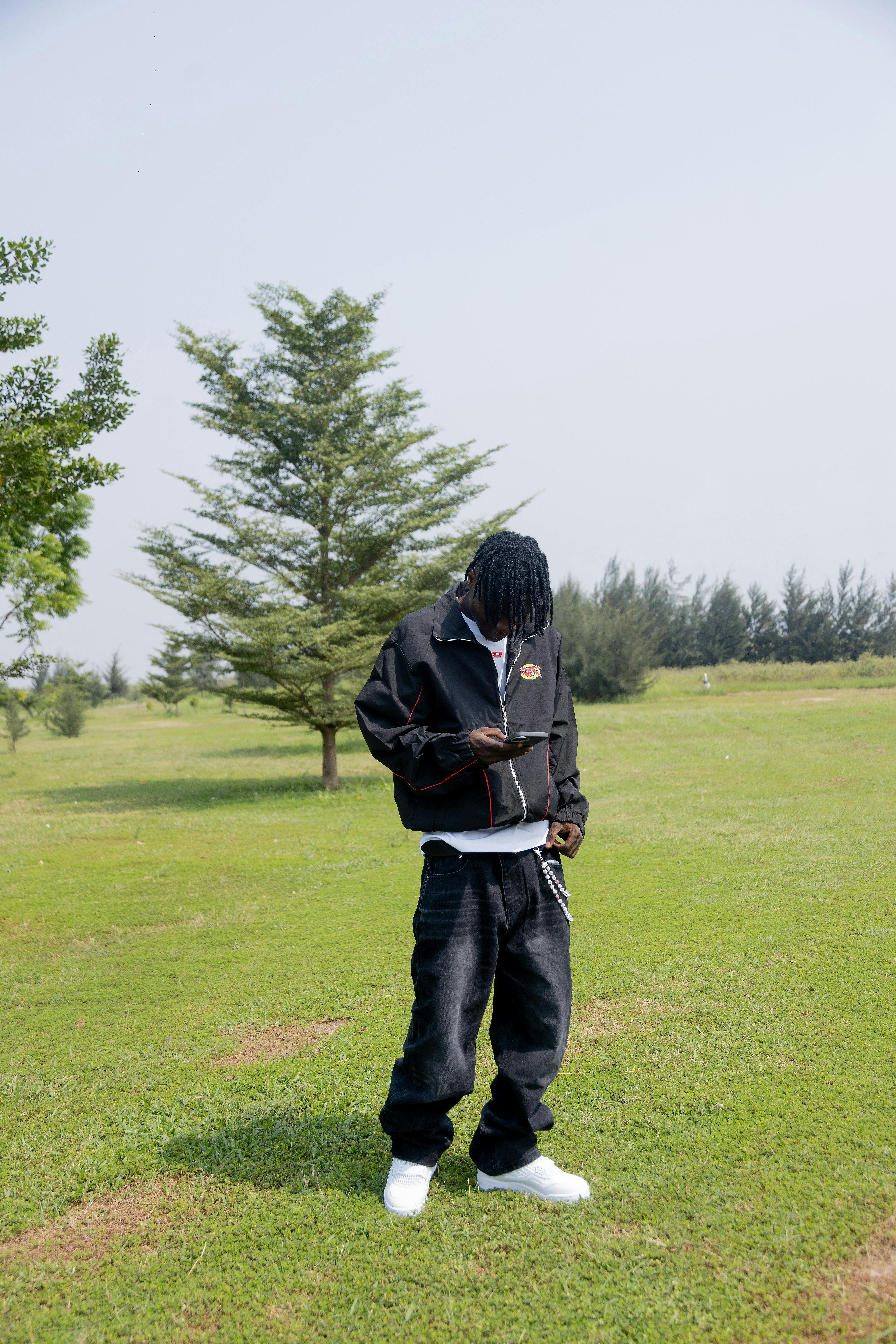 Man Outdoors in Casual Attire on Sunny Day
