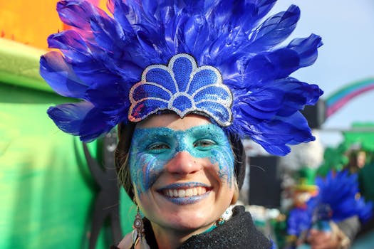 Vibrant carnival scene in Granville, France with a smiling participant in colorful costume.