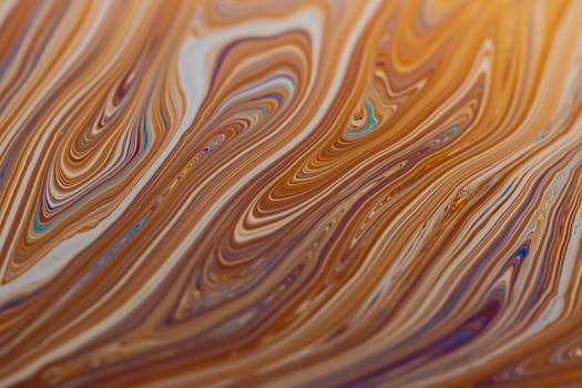 Vibrant abstract design with swirling colors creating a dynamic liquid pattern.