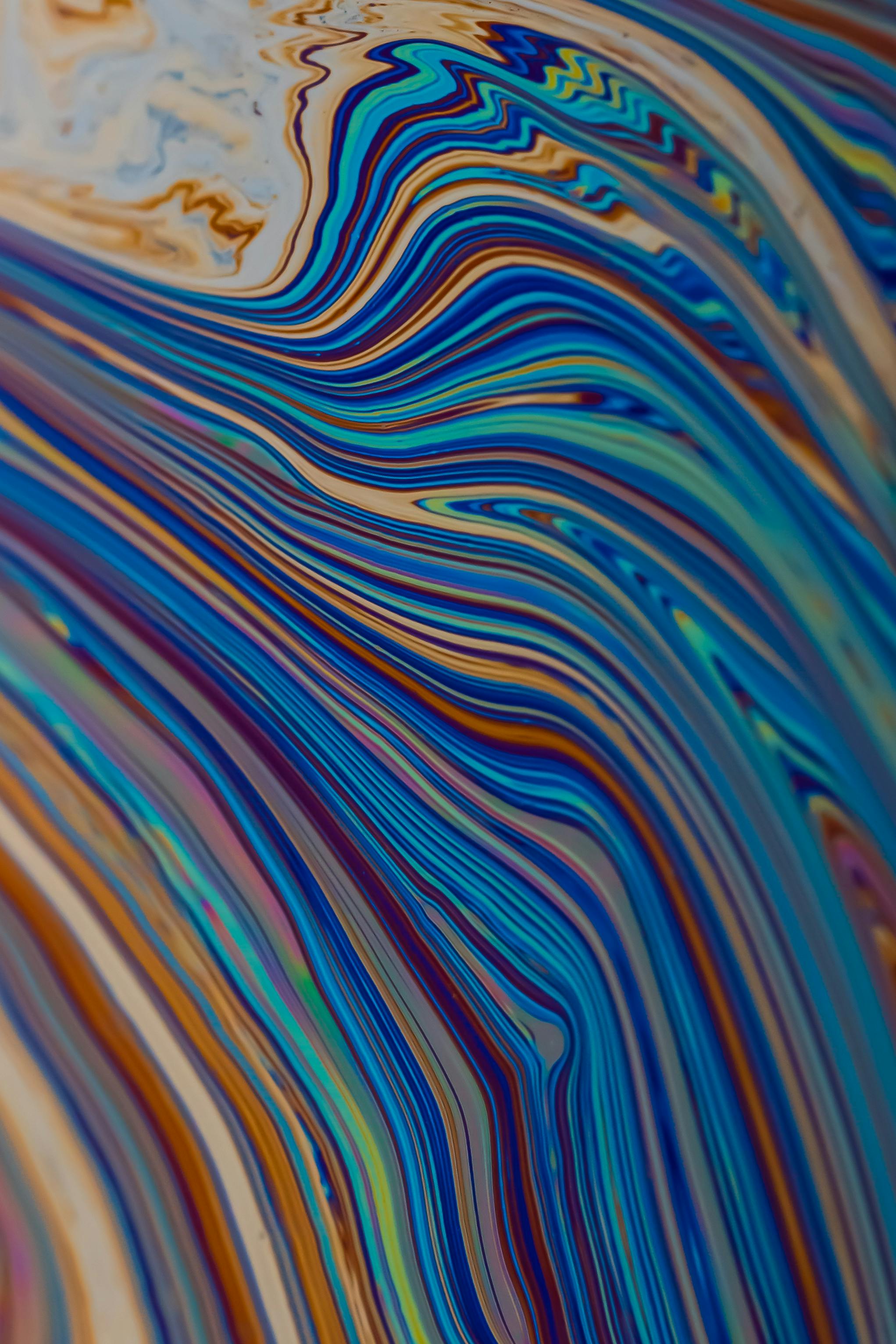 Gratis Farverigt abstrakt marmormønster med hvirvlende blå, orange og brune linjer. Lagerfoto