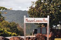 A picturesque sign at Mondele Lookout Point, offering stunning views in Saint Lucia.