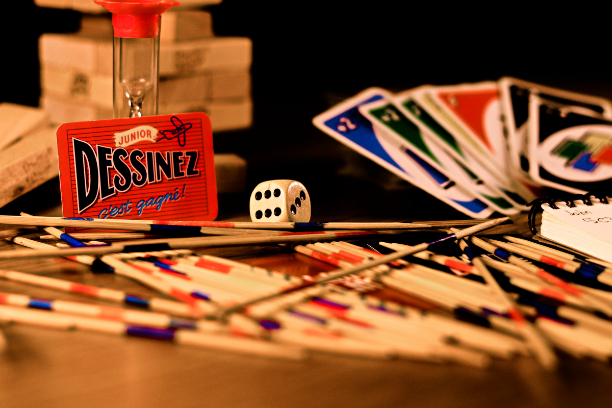 Vibrant collection of vintage board games, cards, and dice ready for game night