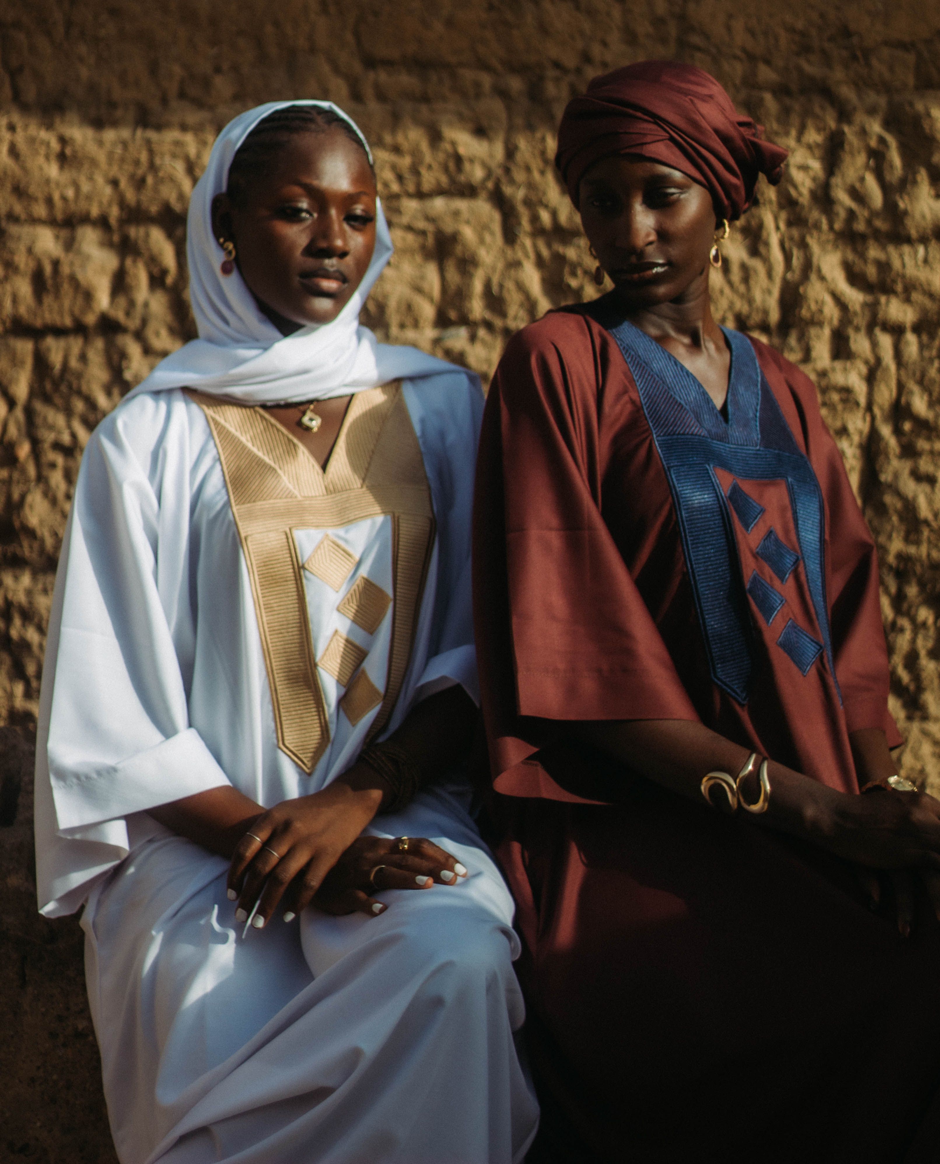 Elegant Portrait of Two Women in Traditional Attire · Free Stock Photo