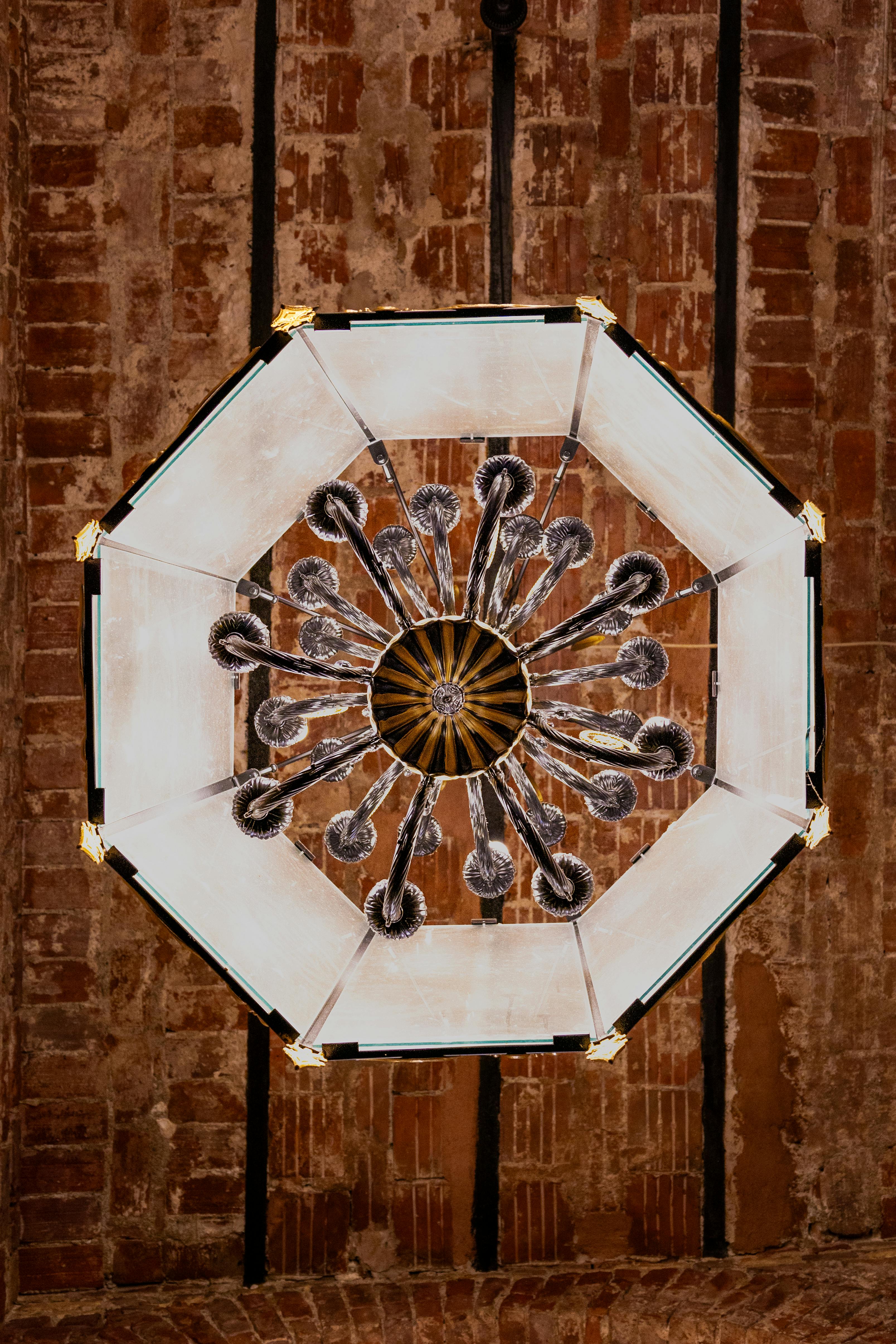 Free A stunning chandelier with intricate designs hanging in a historic setting in İstanbul, Türkiye. Stock Photo