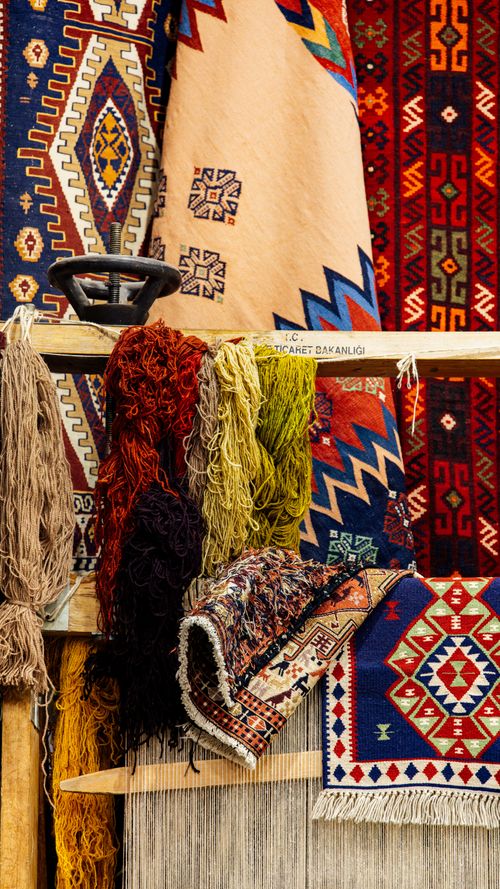 Free A vibrant display of traditional Turkish kilim rugs in Van, showcasing intricate patterns and colors. Stock Photo