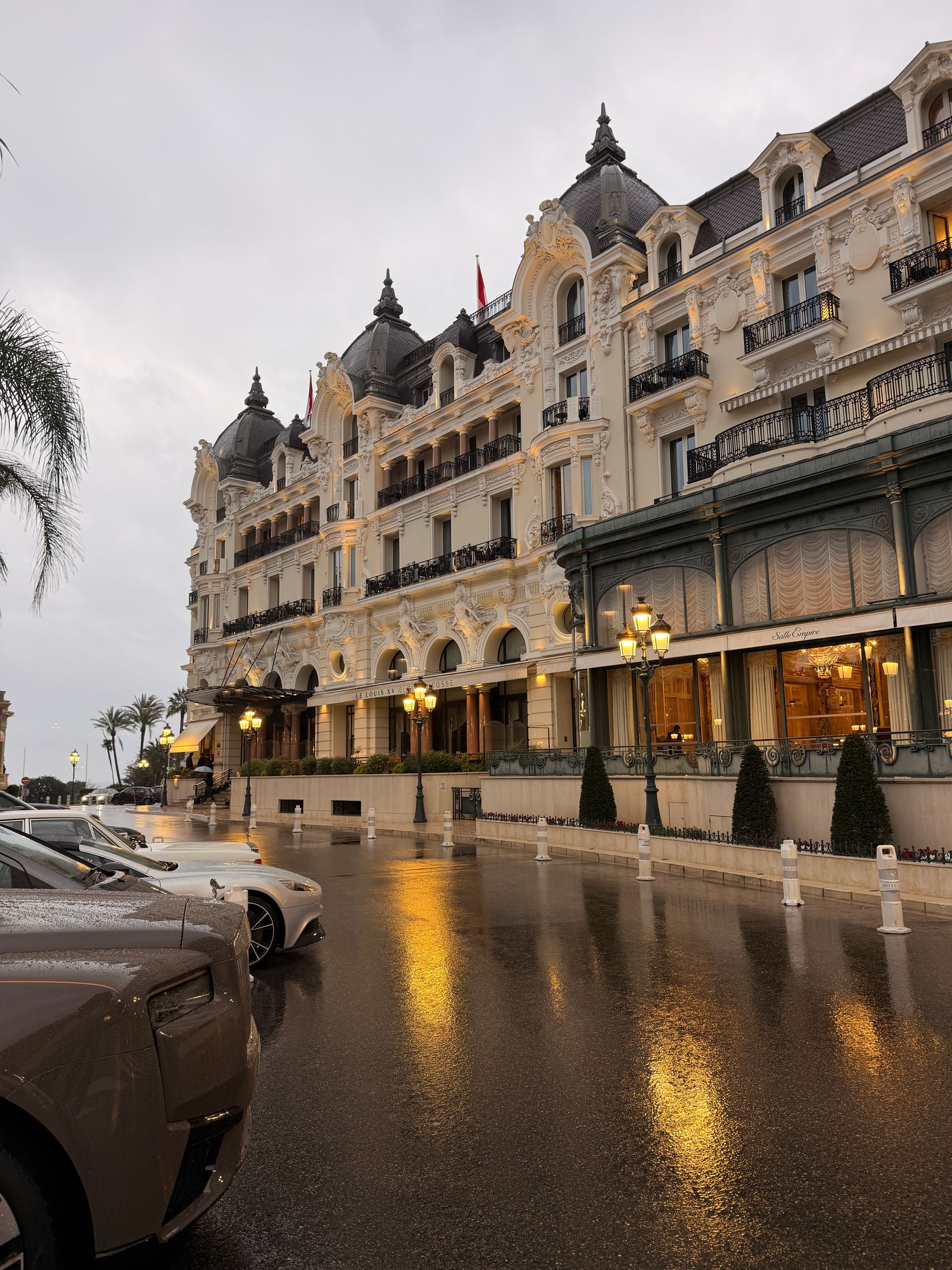 Belle Époque grand hotel façade glowing at dusk