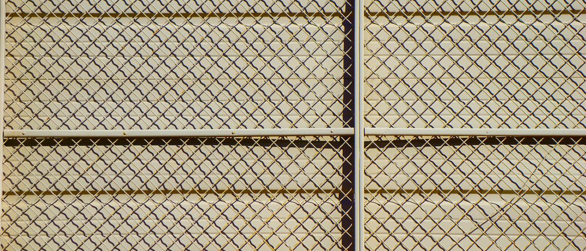 Black ornamental aluminum fence around a yard
