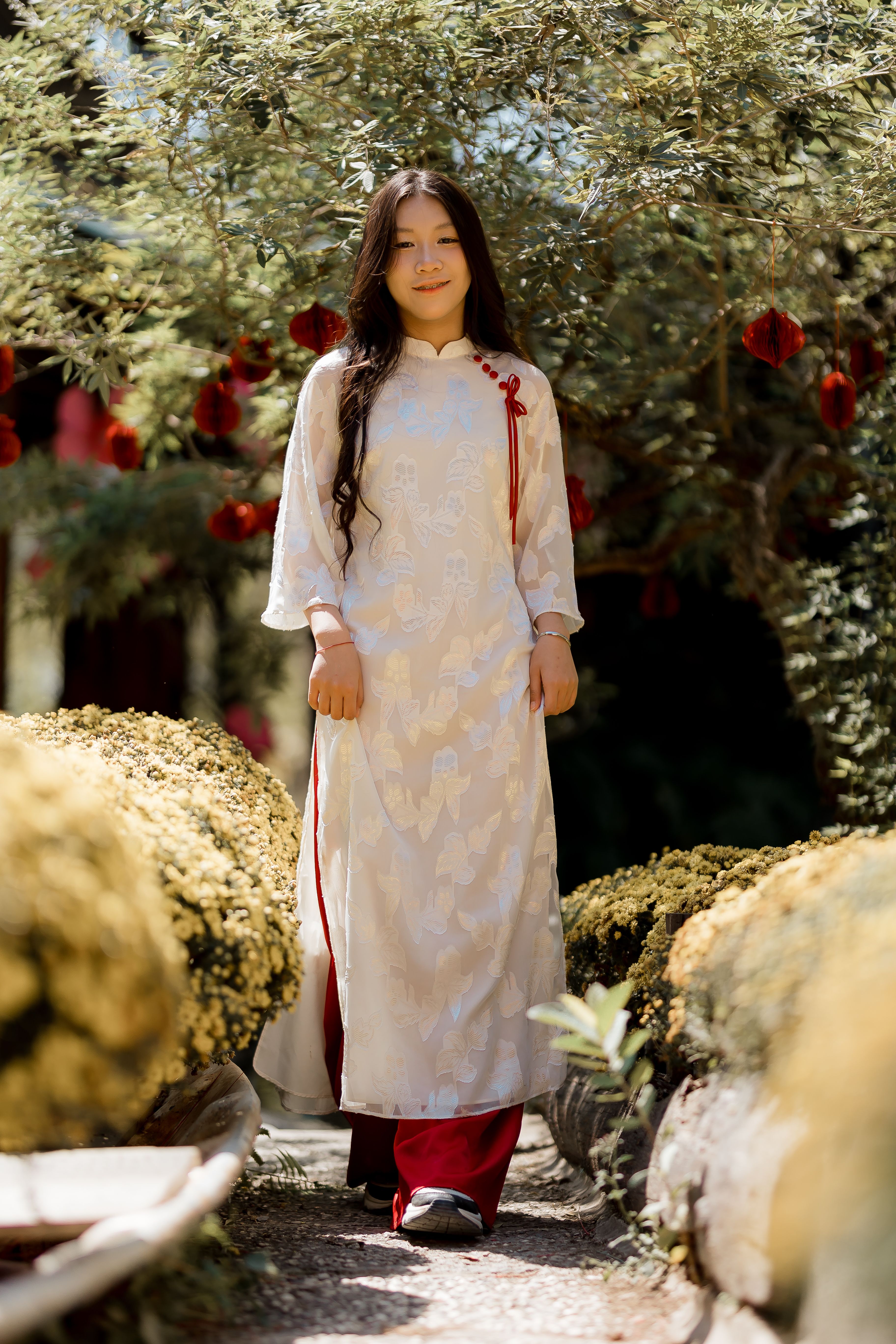 Young woman in traditional dress outdoors · Free Stock Photo