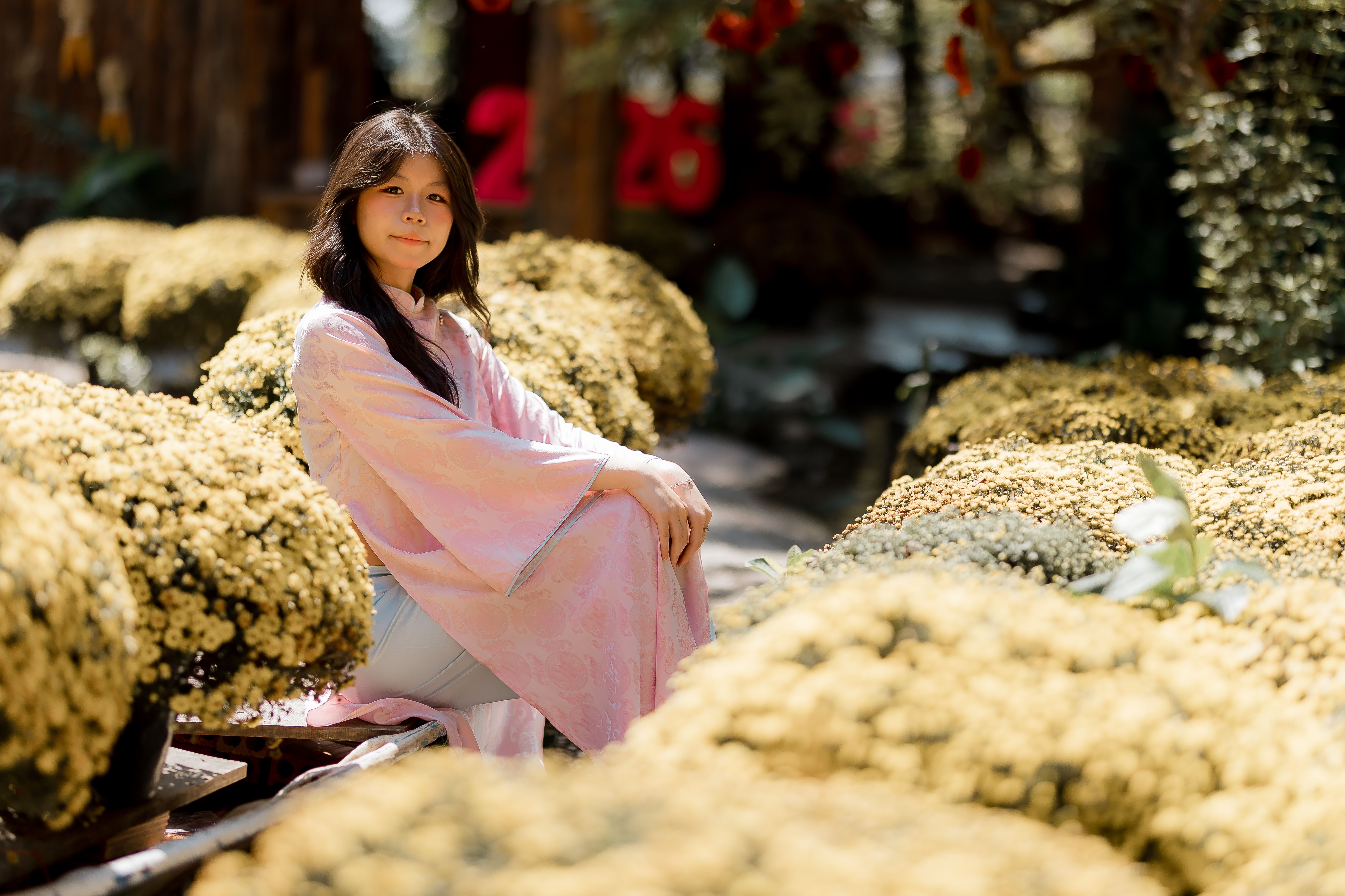 Elegant Woman in Pink Dress Among Spring Flowers · Free Stock Photo