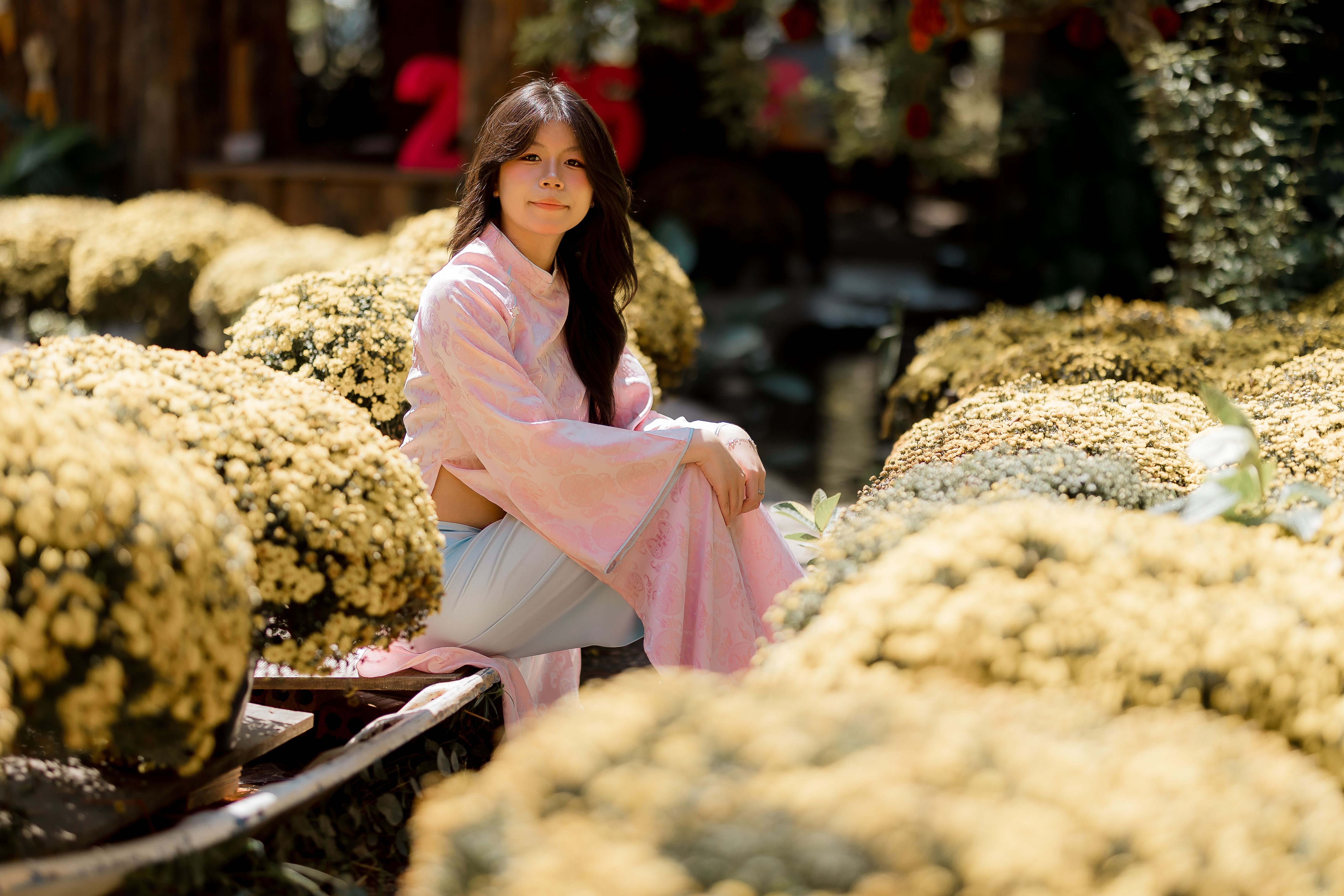 Woman in Traditional Dress in Flower Garden · Free Stock Photo