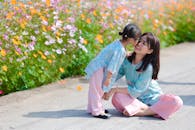 Mother and Daughter Enjoying a Sunny Day Outdoors