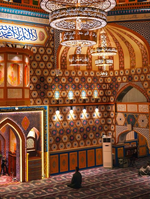 Free Explore the ornate design and vibrant colors of a mosque's interior in Srinagar, India. Stock Photo