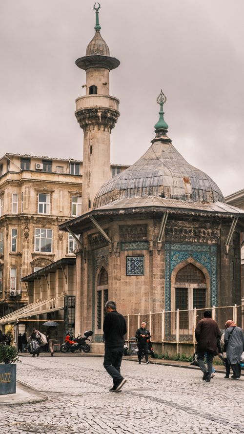 Free Cultural scene with a historic mosque and people in Istanbul, Turkey. Stock Photo