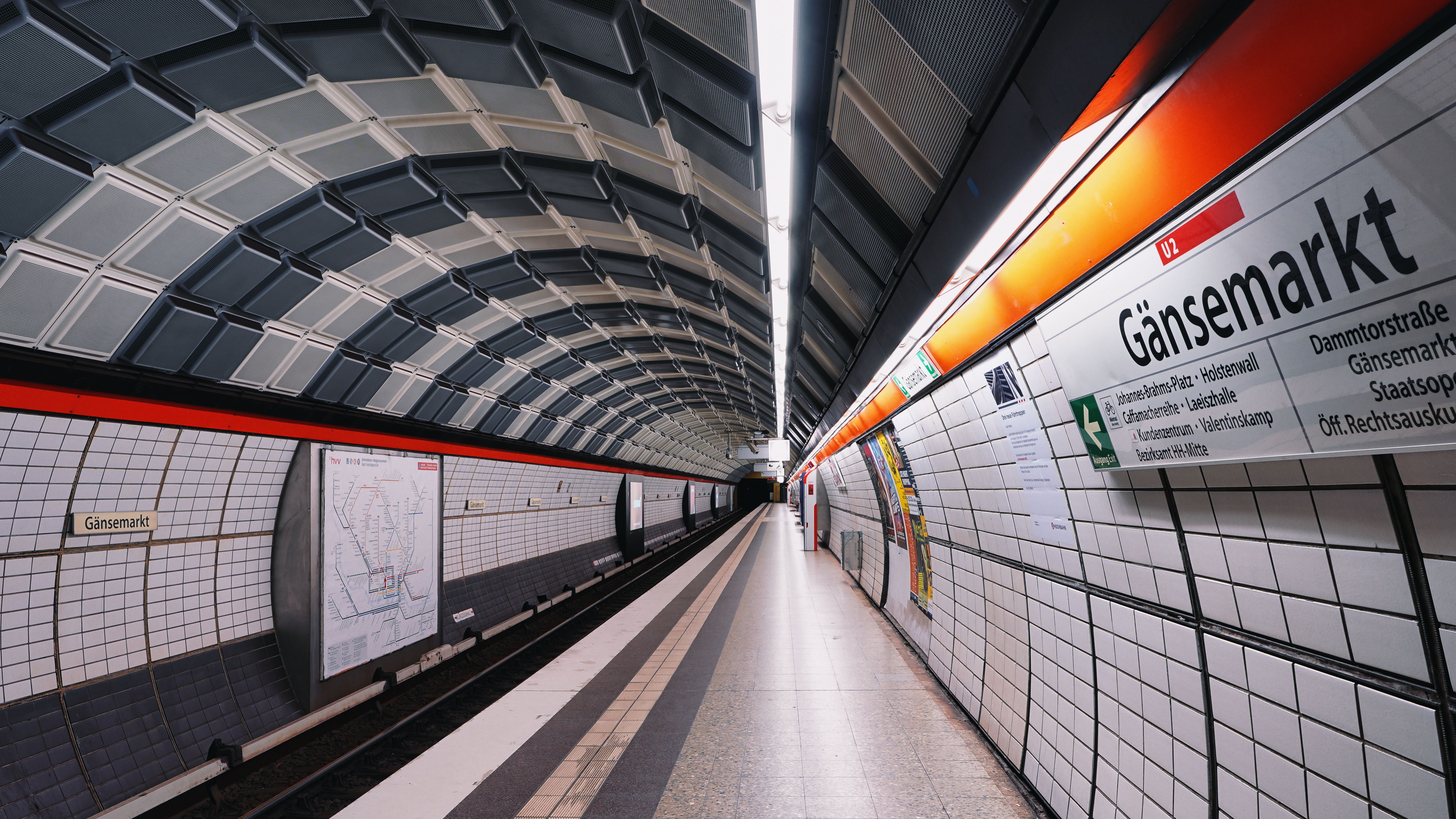 Wide-angle view of the empty Gänsemarkt subway station in Hamburg, Germany.