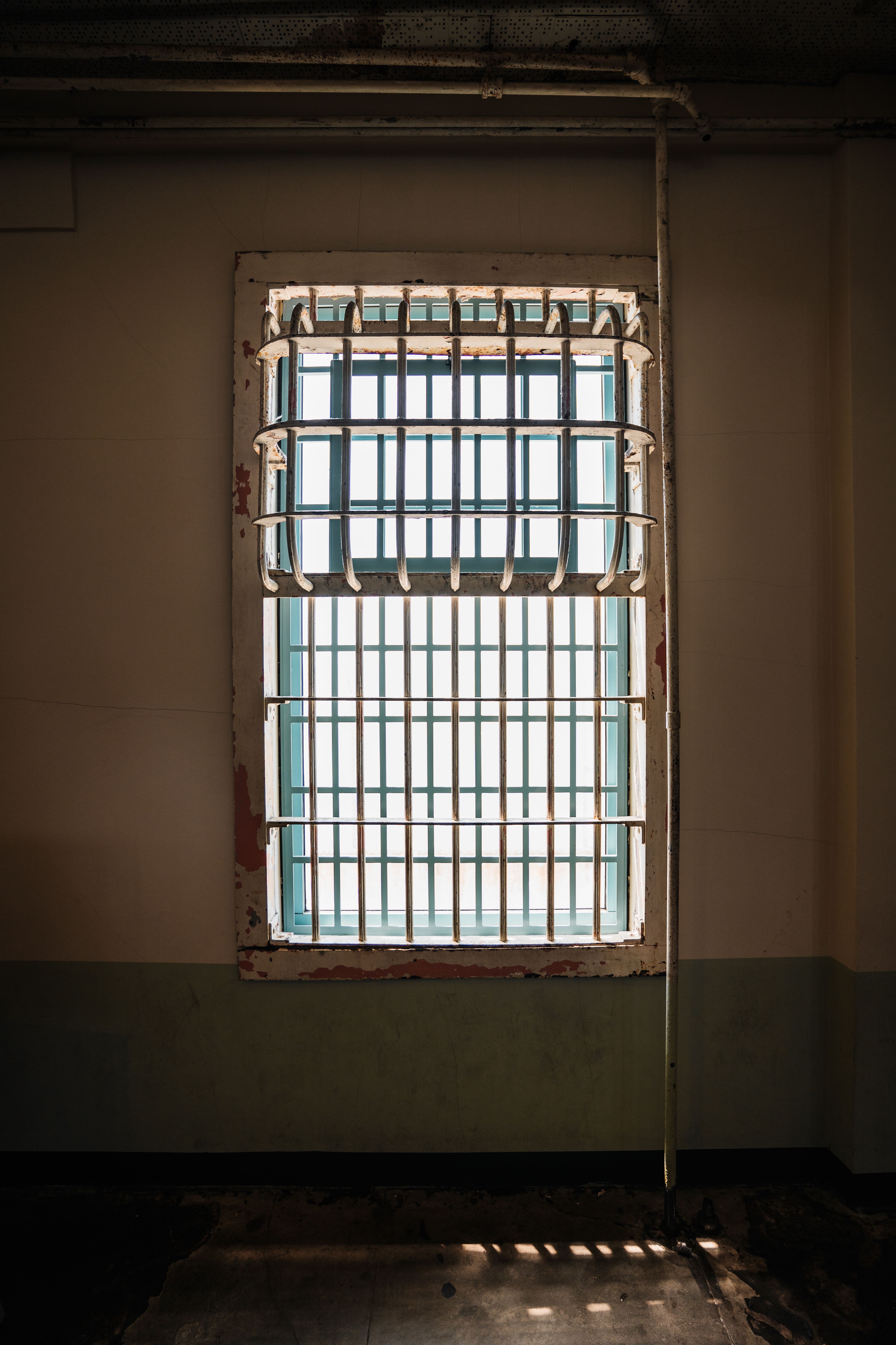 Barred Window of a Historic Prison Cell · Free Stock Photo