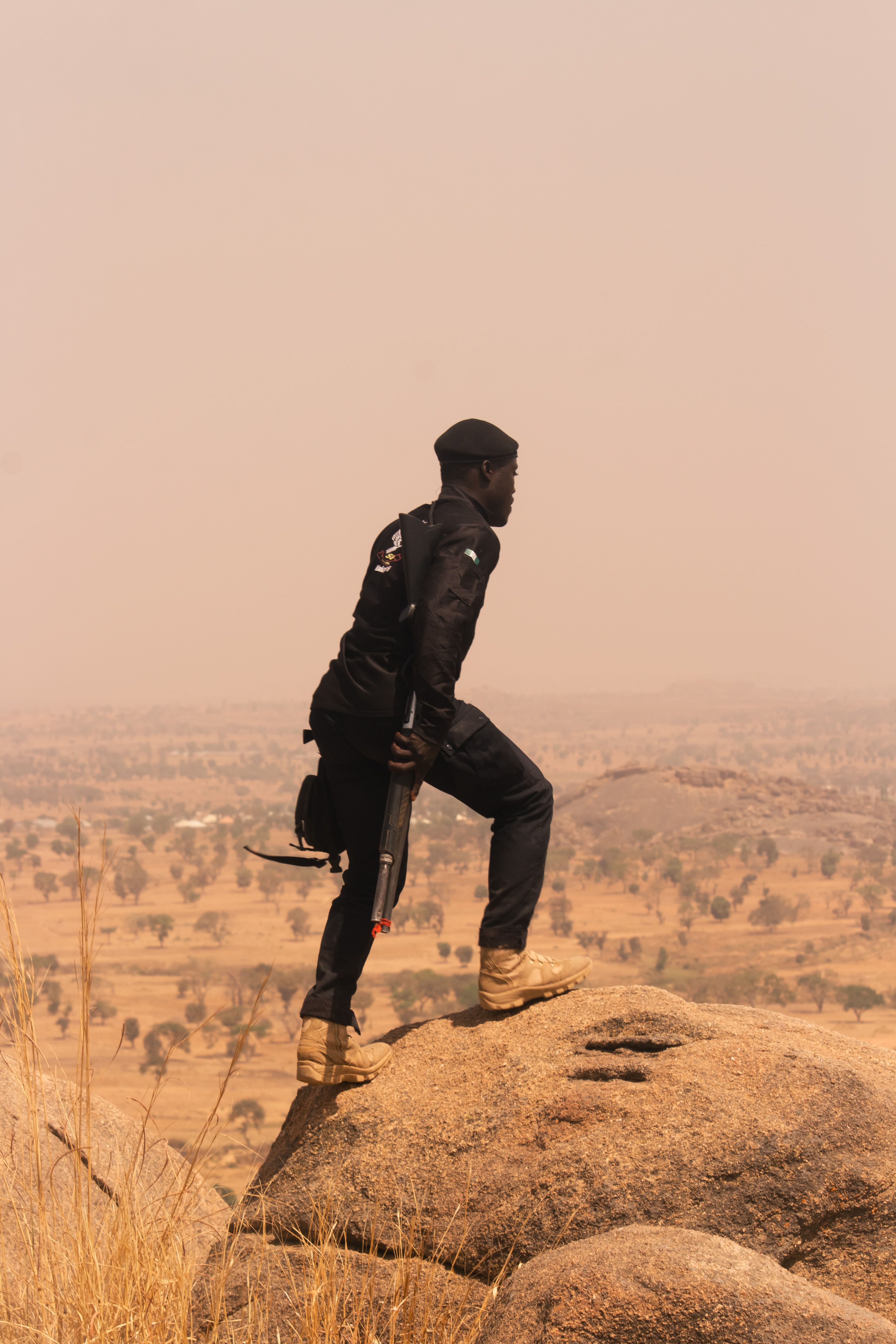 Security officer on high ground overlooking a remote project site