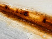 Close-Up of Rusty Surface with Cracks