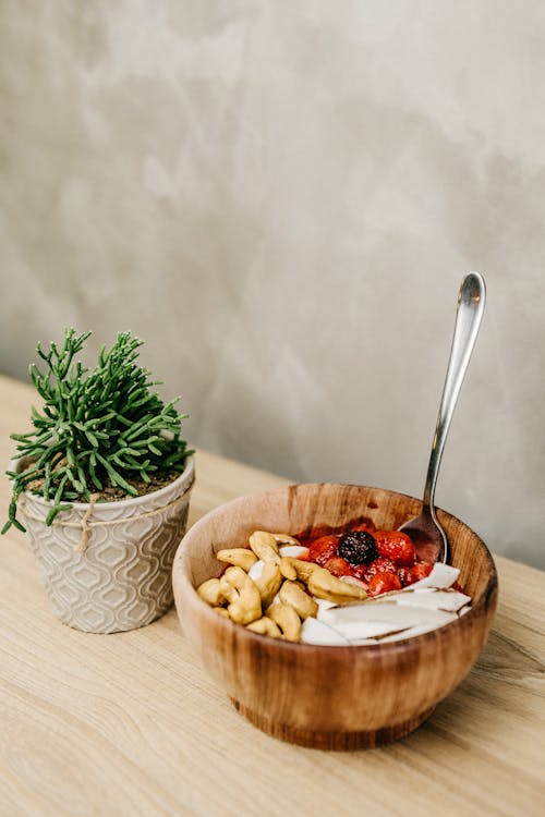 Free Sliced Berries and Cashews in Wooden Bowl Stock Photo