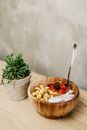 Sliced Berries and Cashews in Wooden Bowl