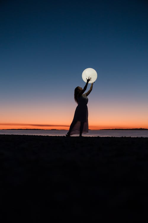 Free Woman Holding a Moon Stock Photo