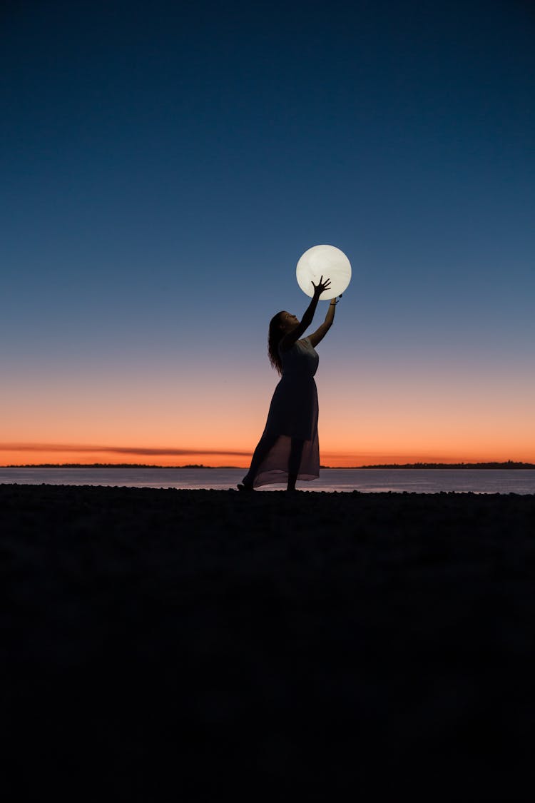 Woman Holding A Moon