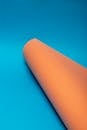 Minimalist Orange Cylinder on Blue Background