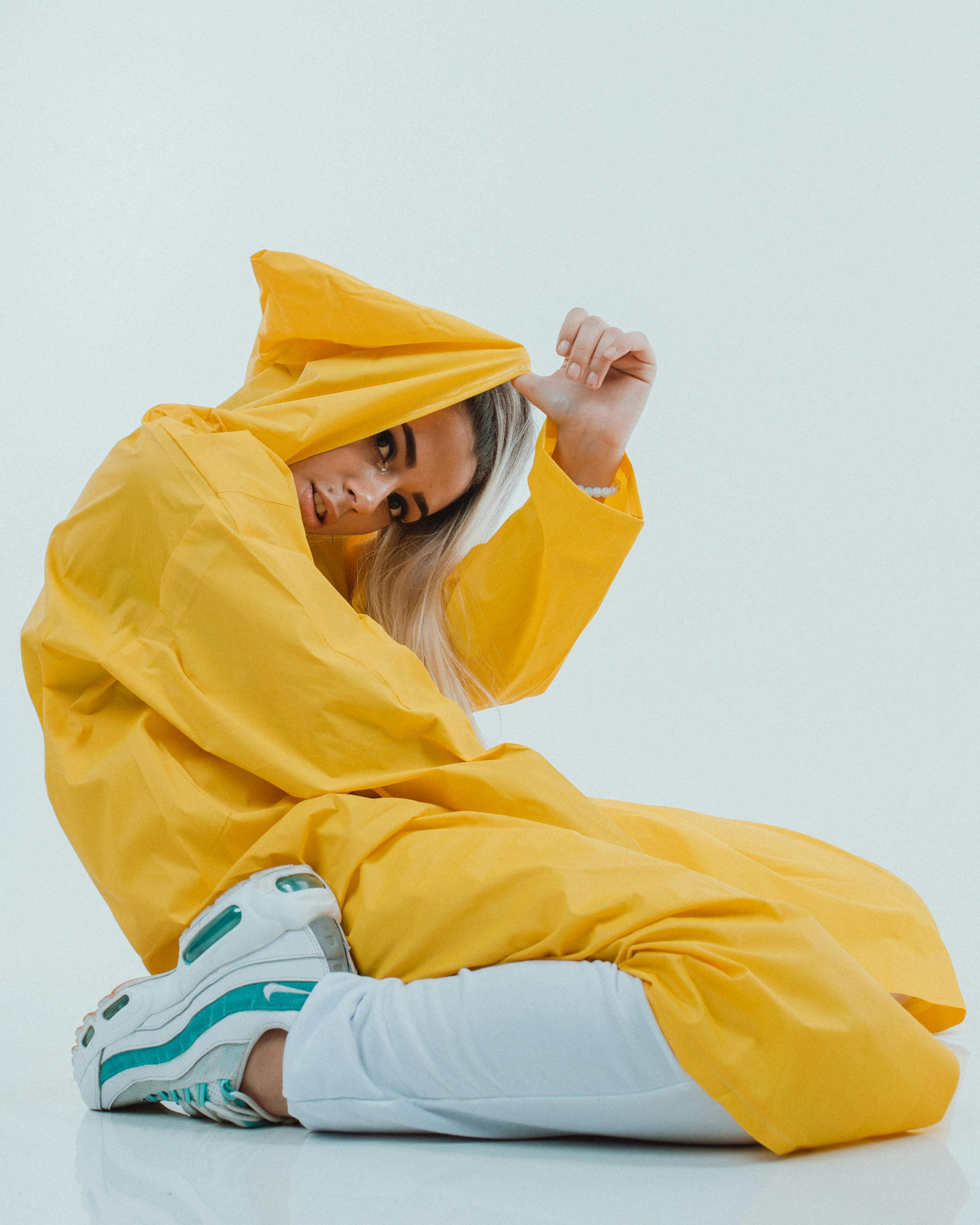 Woman sitting in shallow water practicing mindful breathing