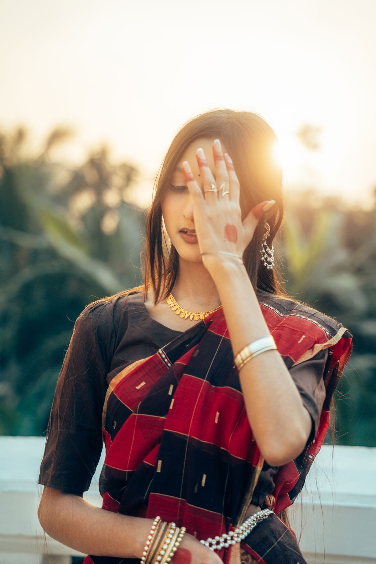 Elegant Young Woman in Traditional Saree at Sunset · Free Stock Photo
