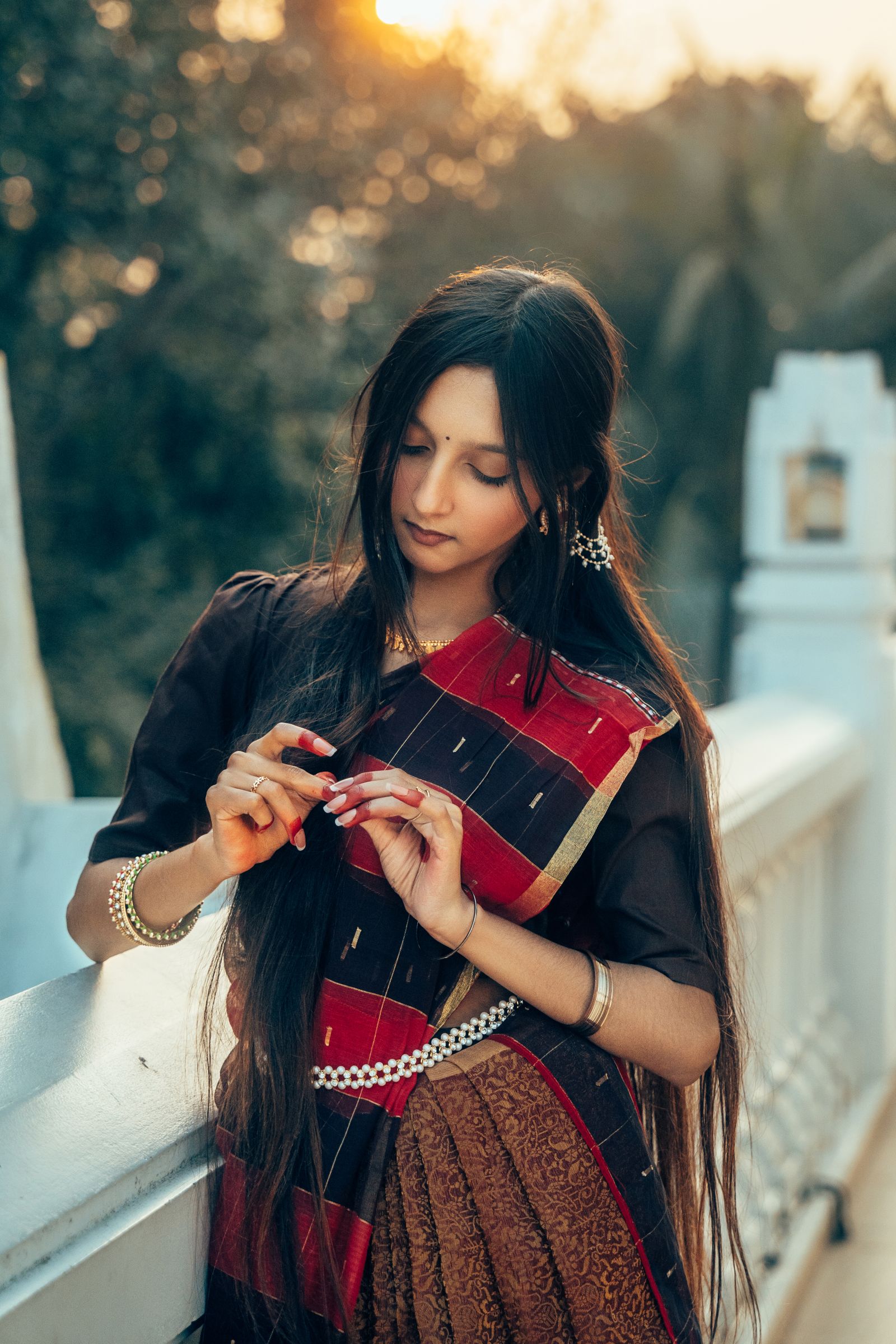 Elegant Young Woman in Traditional Saree at Sunset · Free Stock Photo