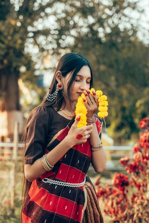 Free Portrait of a South Asian girl embracing cultural attire, with a serene outdoor backdrop, in Cumilla, Bangladesh. Stock Photo