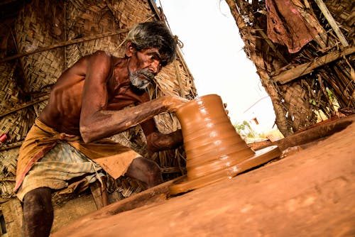Free Man Making Clay Pot Stock Photo