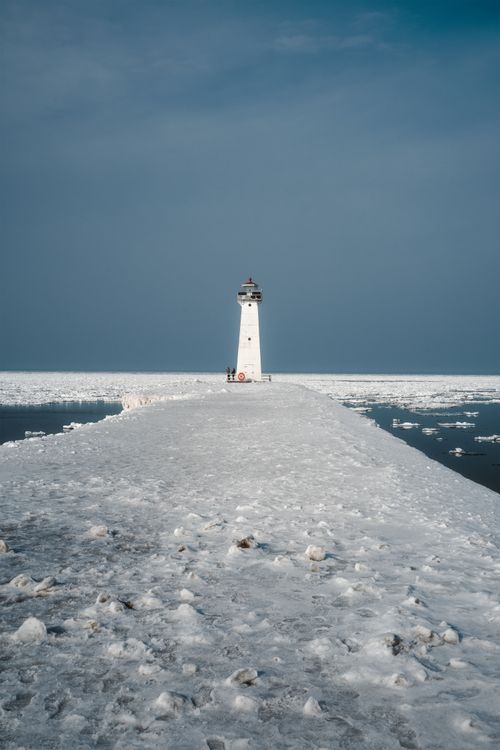Free Stunning view of Sodus Point Lighthouse amidst icy waters on Lake Ontario. Stock Photo