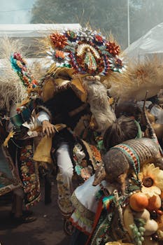 Colorful dancers in traditional Mexican attire at a lively festival outdoors.